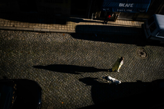 Woman with dog walking in Porto