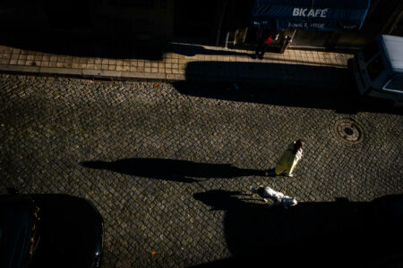 Woman with dog walking in Porto